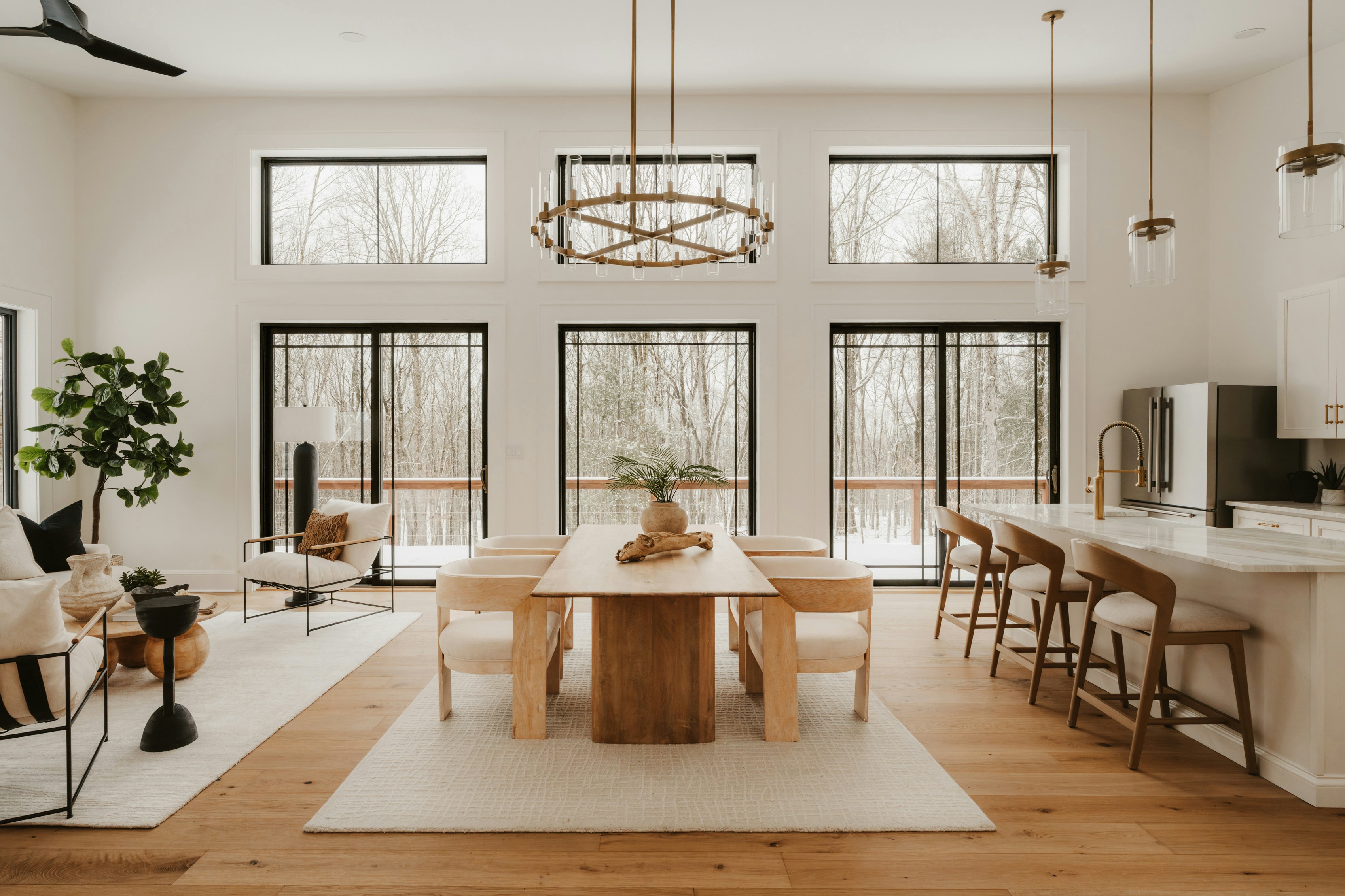 Warm organic contemporary living room with sculptural furniture and afternoon light